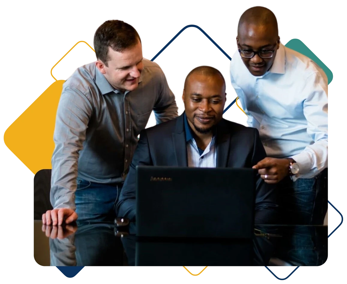Three-business-men-gathered-around-a-laptop 1